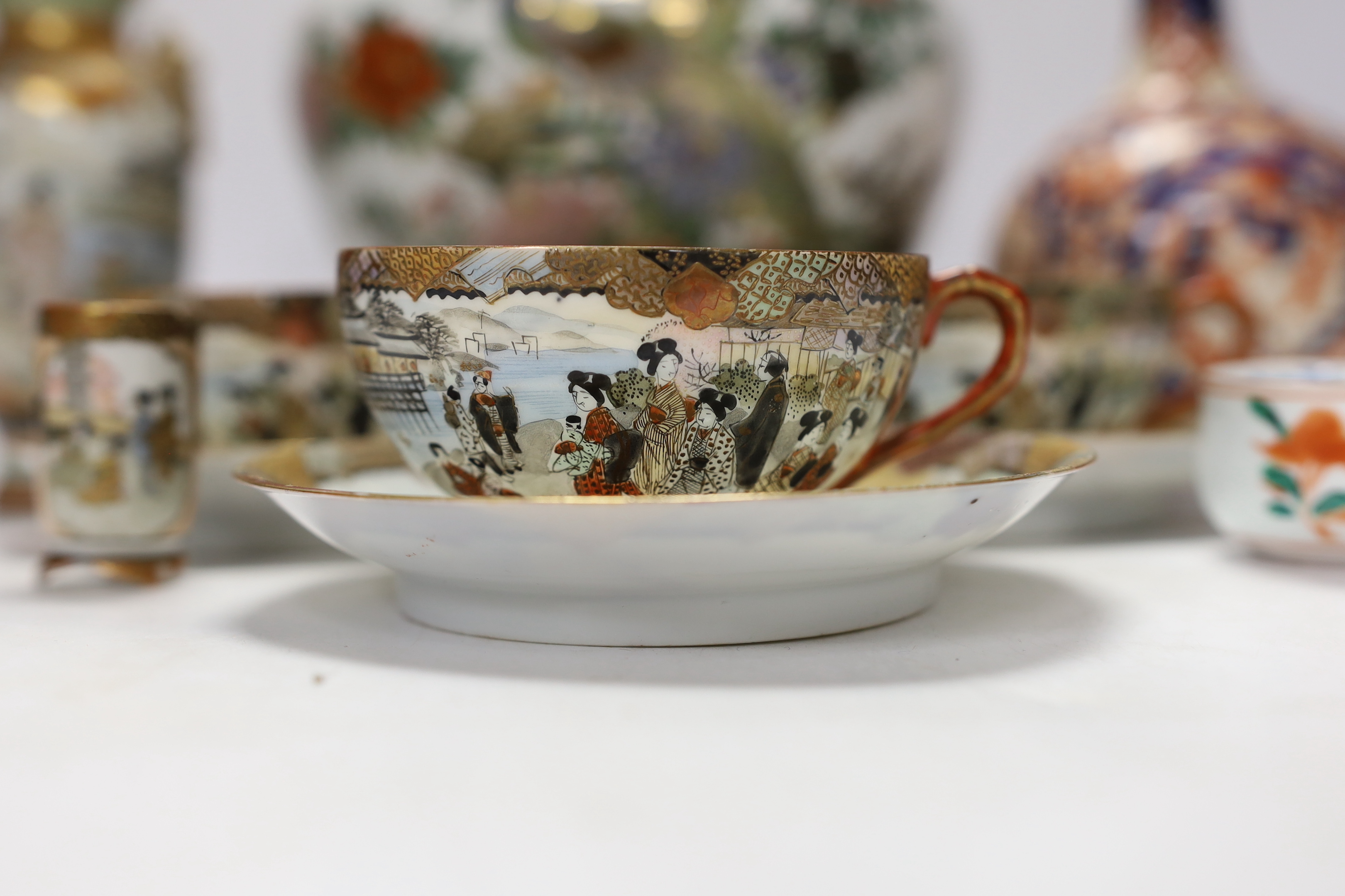 Japanese ceramics including an Imari bottle vase, a Satsuma vase and Kutani eggshell porcelain, tallest 22cm (8)